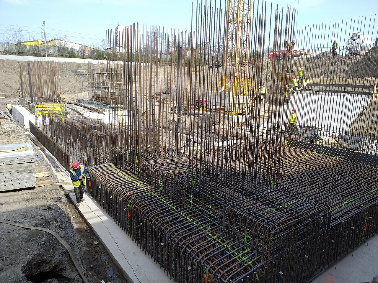 Workers on a reinforced concrete foundation